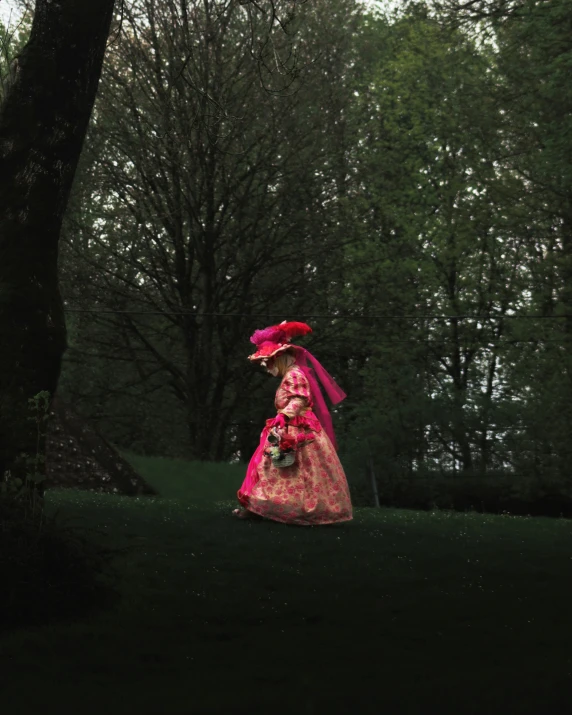 a person in red and pink with red veil, flowers, and bouquet