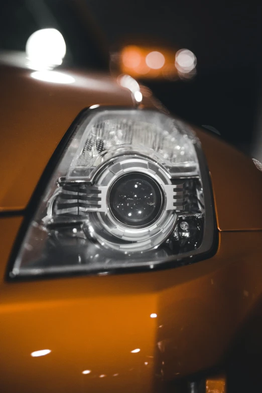 the side view of a yellow car with black and white light