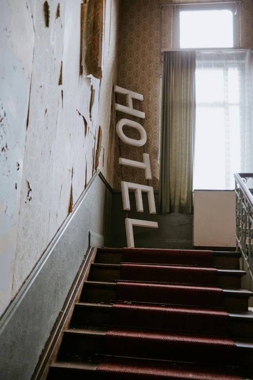 this is a picture of a hallway with a el sign on the wall