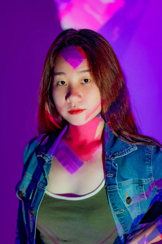 a young woman with light painting on her body