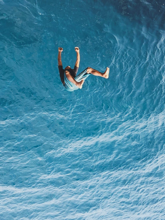 a man riding on the back of a wave