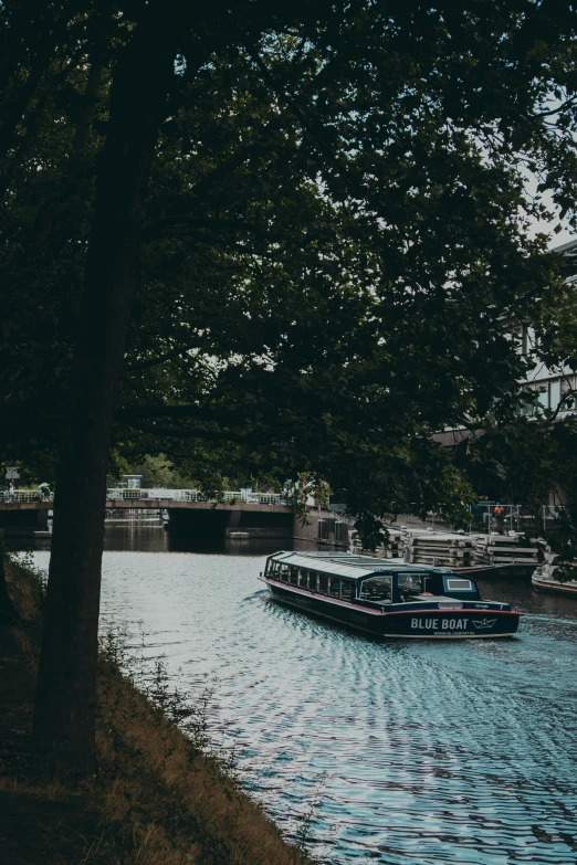 a boat in the river on a very cloudy day