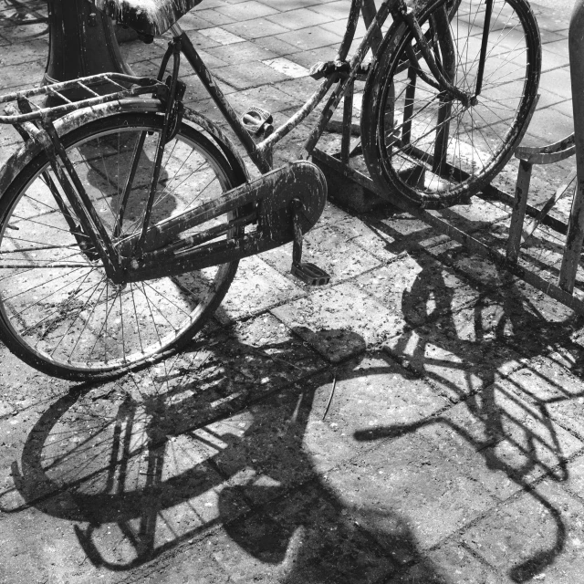 the two bikes are parked next to the water hydrant