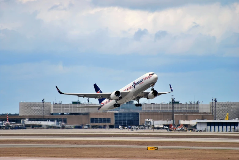 a jet airliner in mid air, taking off