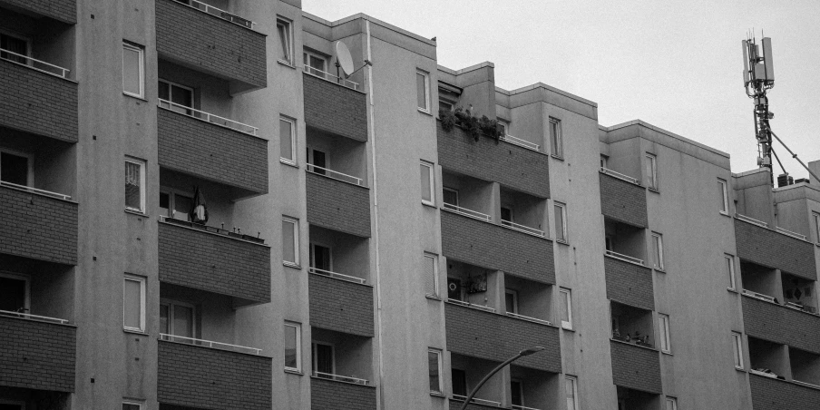 a row of tall brick apartment buildings