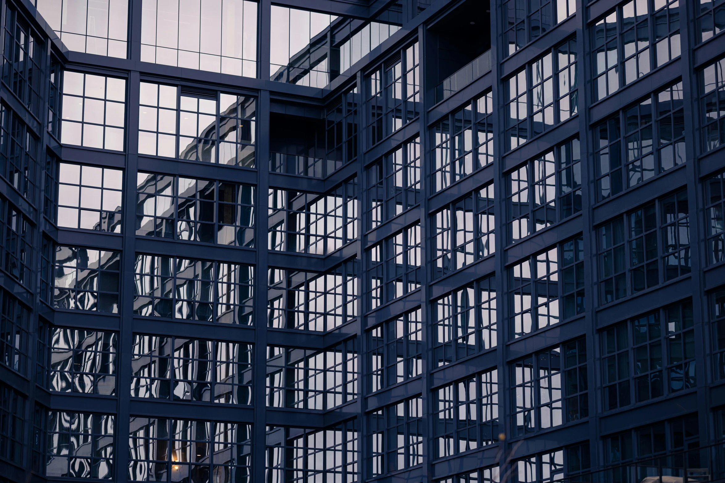 an upward view of the steel - framed architecture of a building