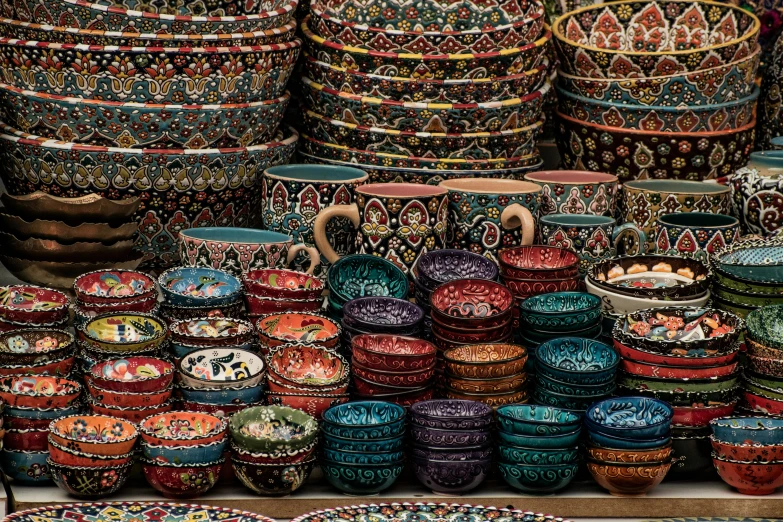 a ortment of different colored pots in a shop