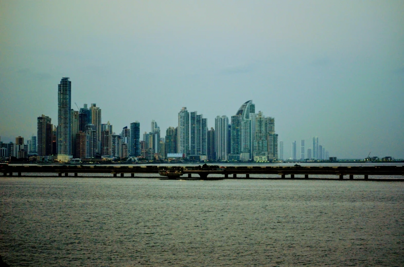 there are many large buildings next to the water