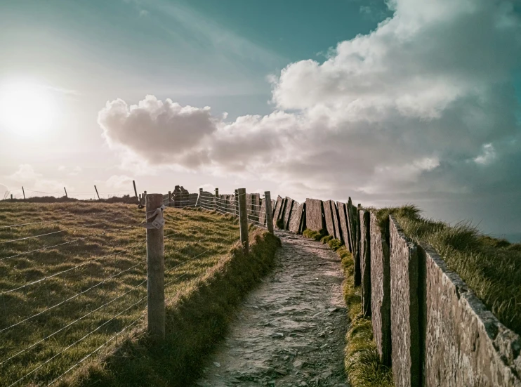 the path to the top of this mountain runs alongside a barbed wire fence