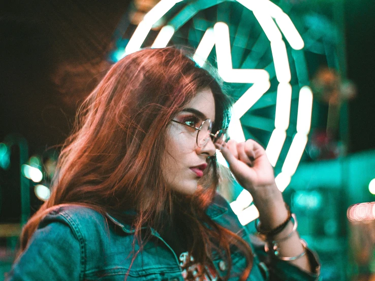 a woman is standing in front of a star sign