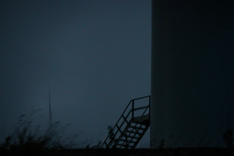 a man walks on the stairs to a sky background