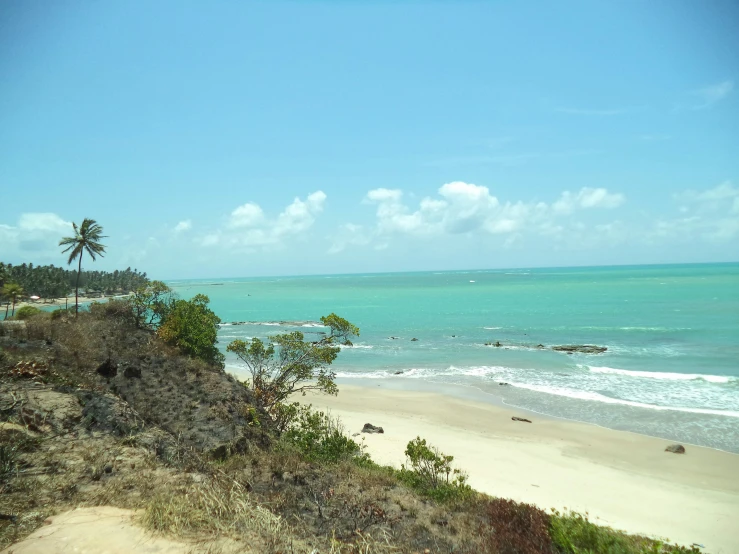 an ocean view from top of a hill