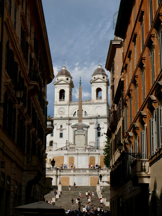 a large building next to some tall buildings