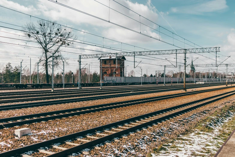 a train track with some electrical lines on it