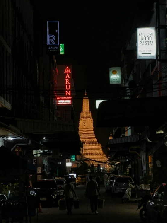 night time in an asian city with people walking down the street