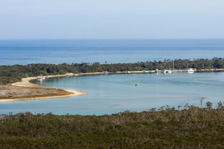 the boats are floating on the water in this lagoon