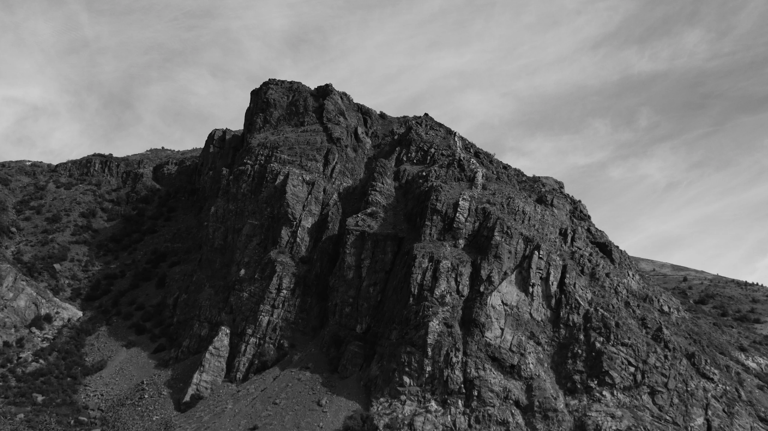 a black and white pograph of a rocky outcropping