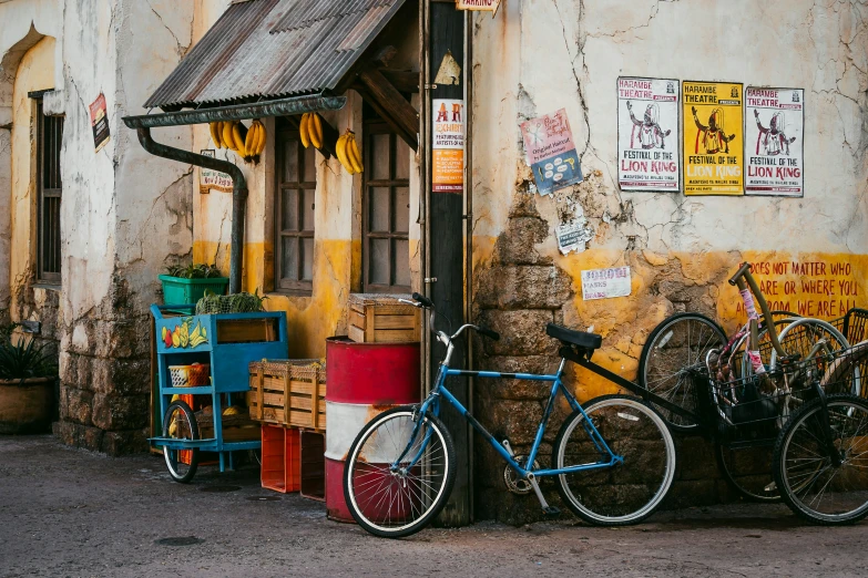 three bicycles are parked outside of a house