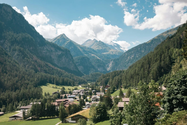 a scenic picture of a town in the mountains