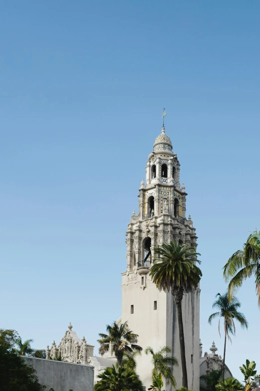 an old tower is shown with palm trees