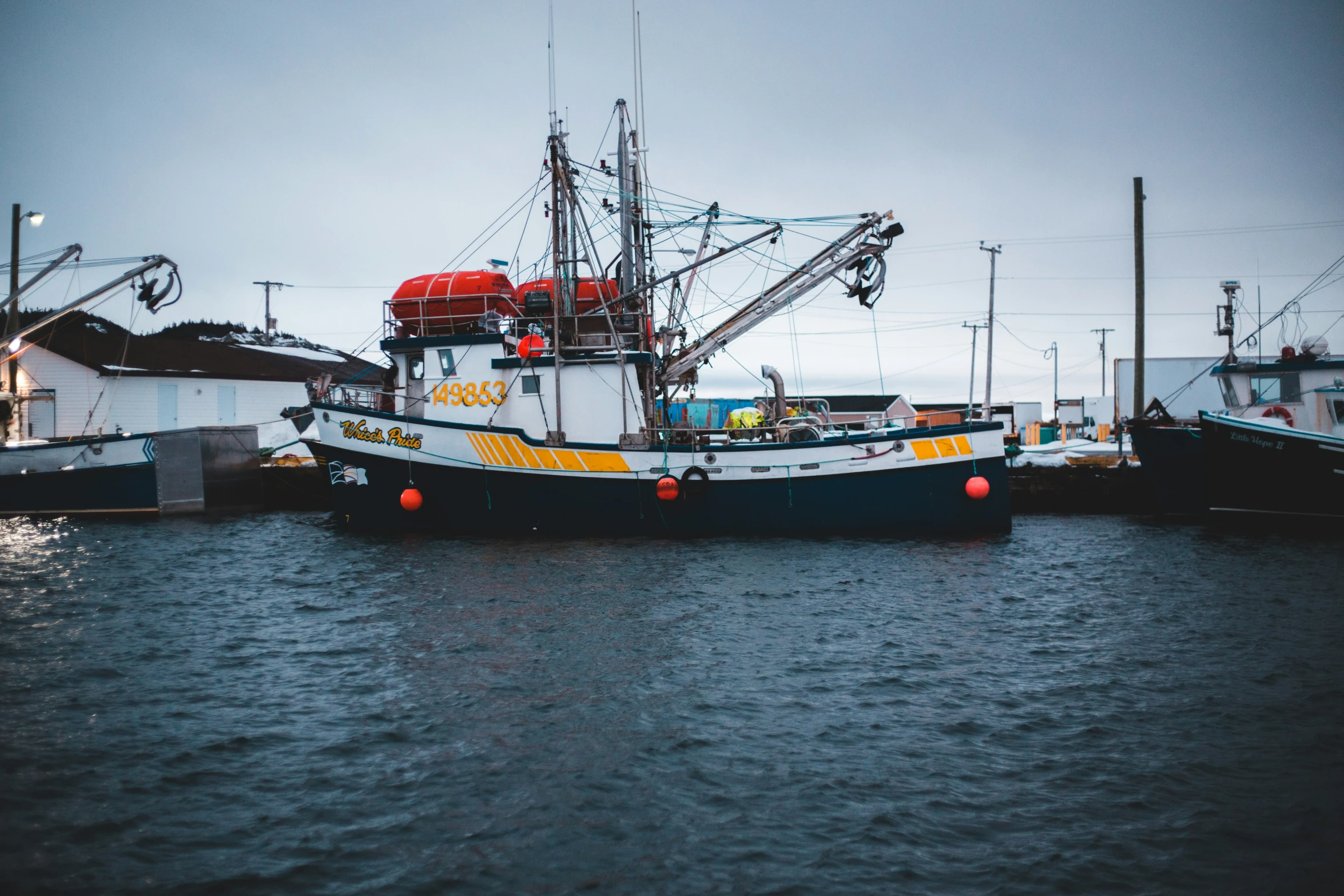 a boat sits in the middle of the water