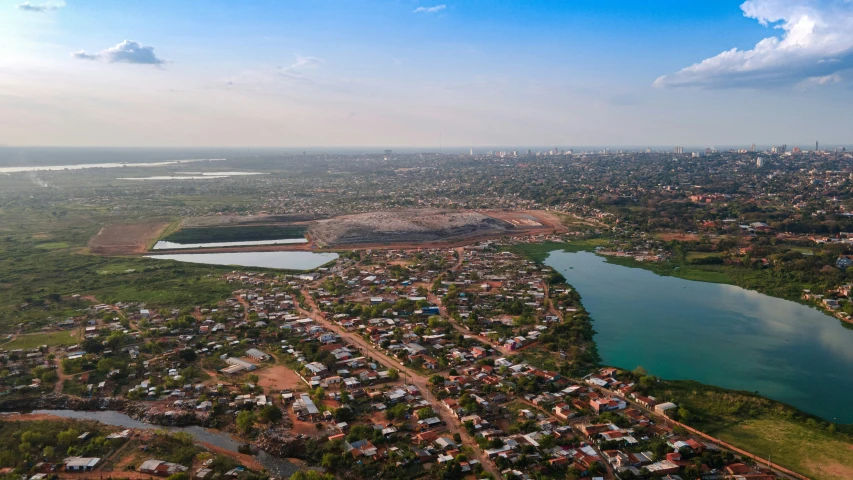 this is an aerial view of a city by the water