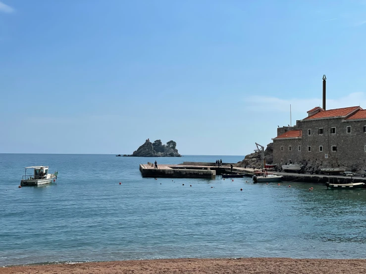 the boats are docked near the small city