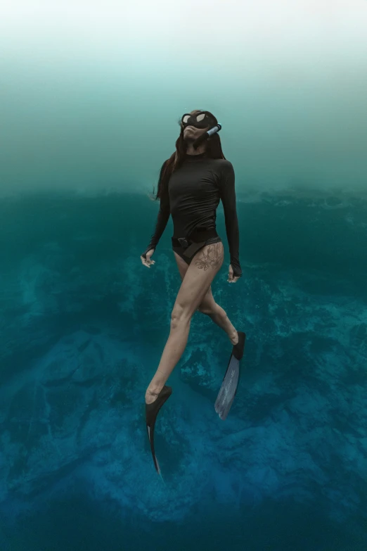 a girl diving in a body of water