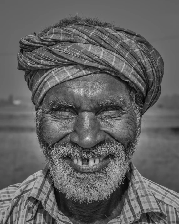 a man with a beard and wearing a turban