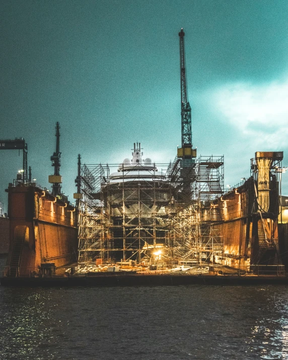 the large machinery works on the water near a ship