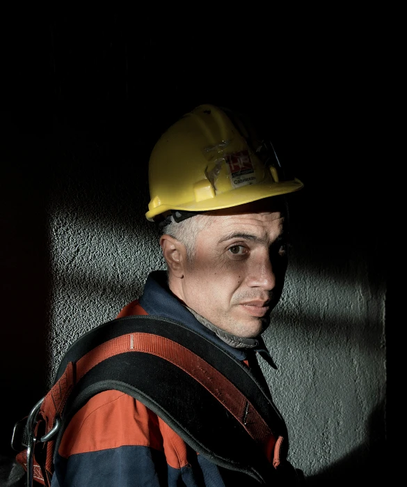 a man in a hardhat is standing up