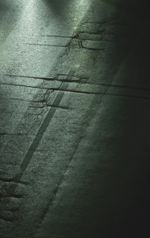 a view of a wet street during the night