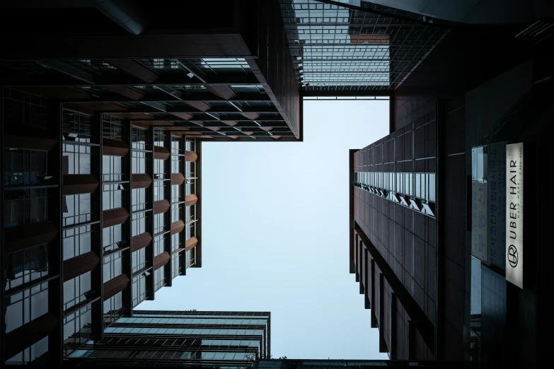 a view looking up into a modern structure at dusk