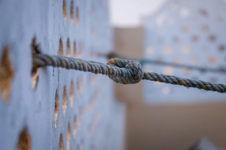 the rope is tangled on top of the building