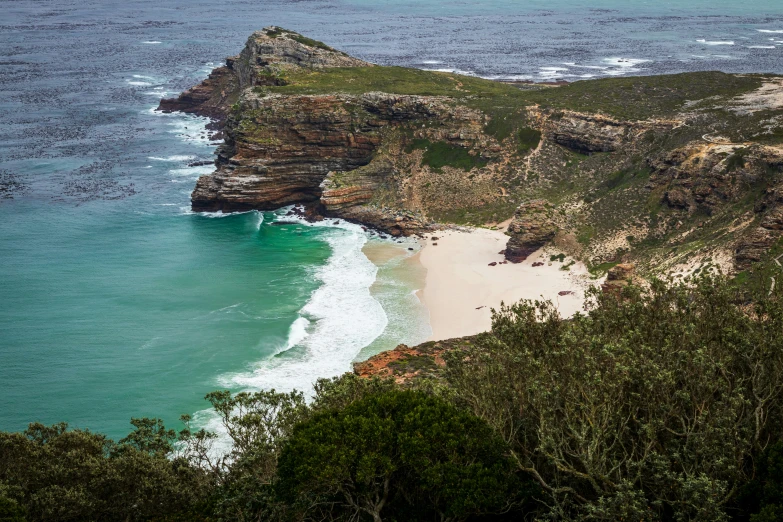 this is an aerial view of a beach with a sandy coastline