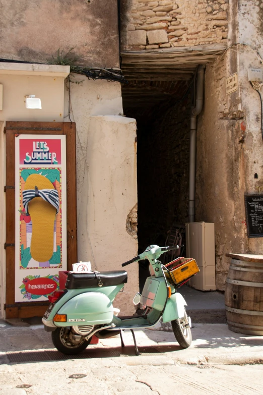 a moped sitting outside a doorway of a building