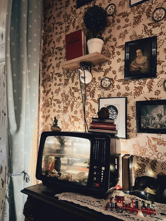 a small television sitting on top of a wooden table