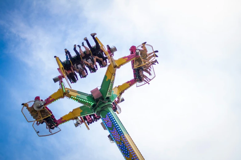 a large ferris ride with people sitting on top