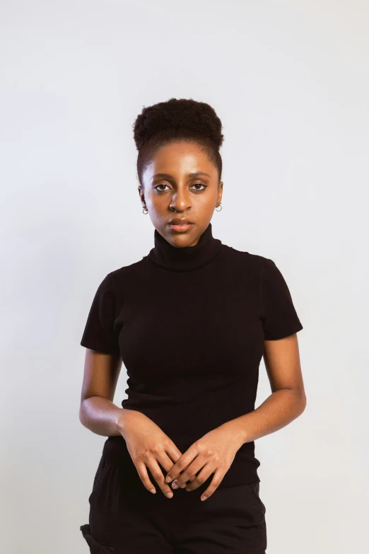 a woman standing up wearing black clothing