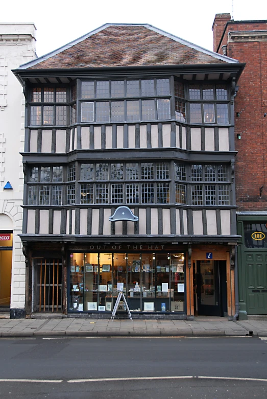 an old style building sitting on the side of a street