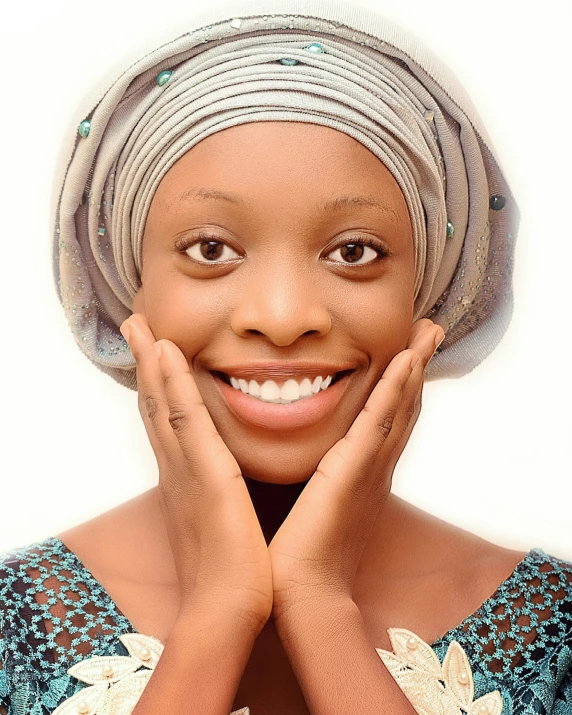 an african american woman wearing a turban and smiling