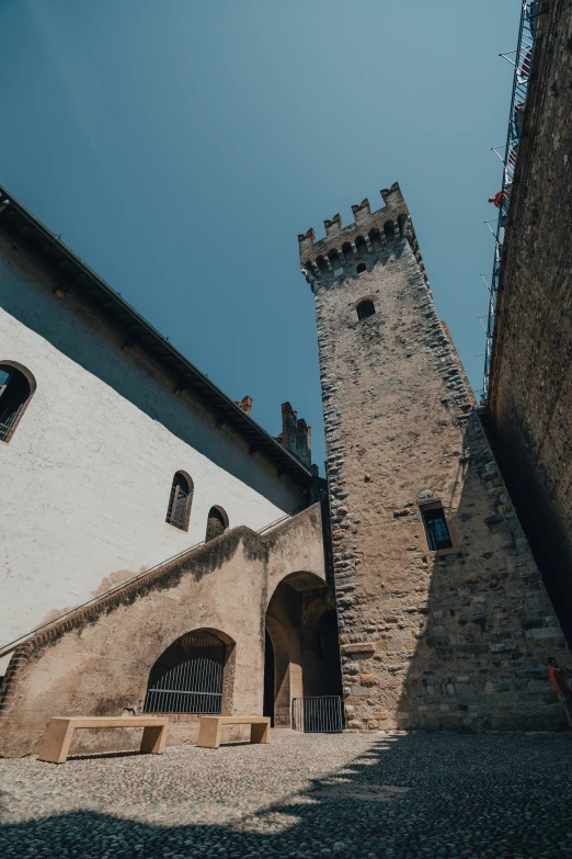 a tower with an open window is against a wall