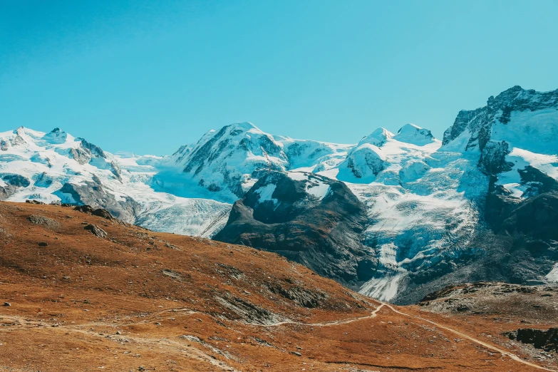 snow covered mountains are shown with no clouds