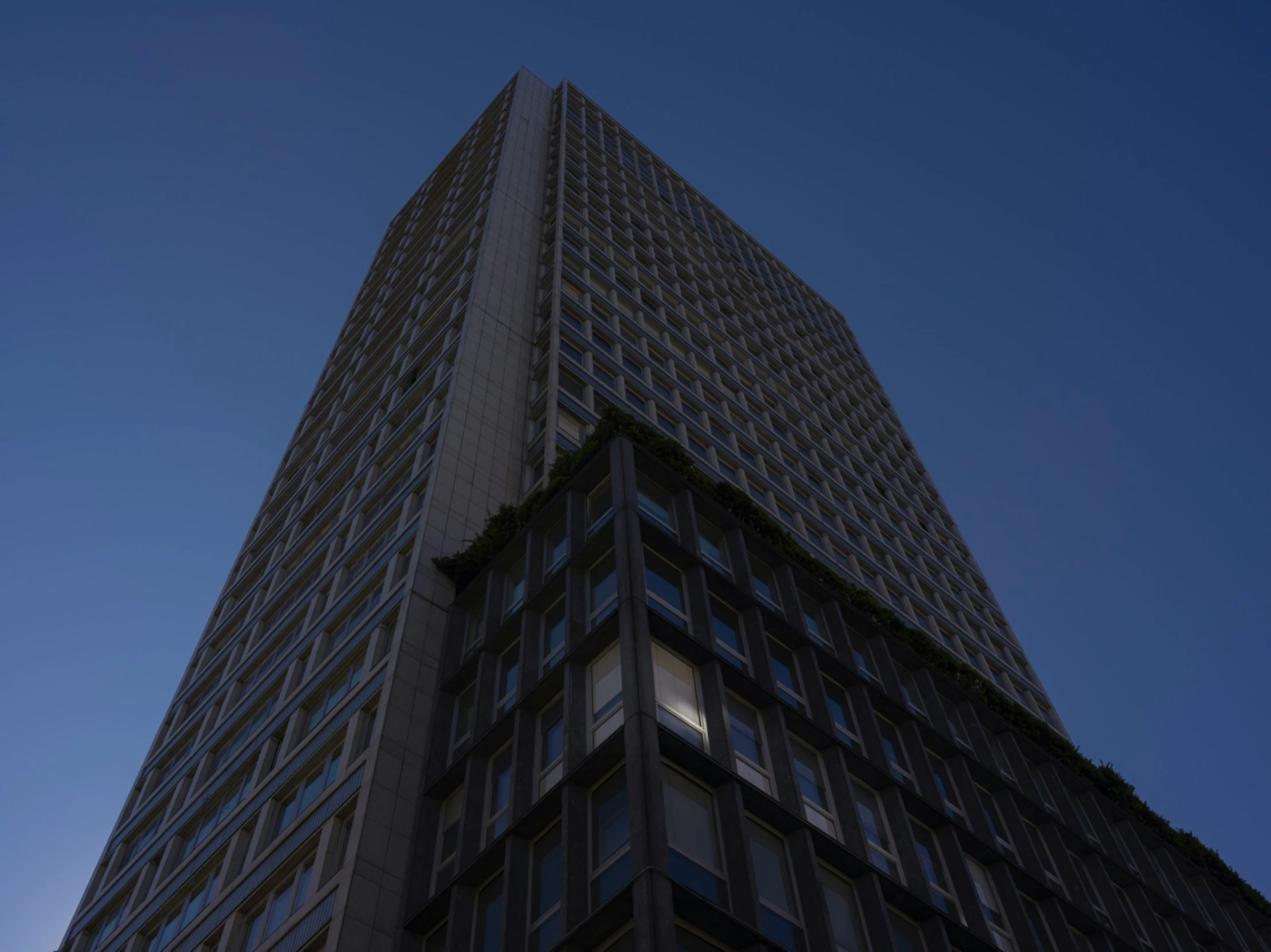 a very tall building with some lights inside of it