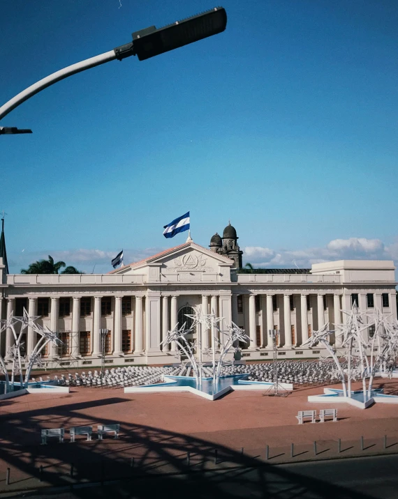 an architectural building with white pillars and windows