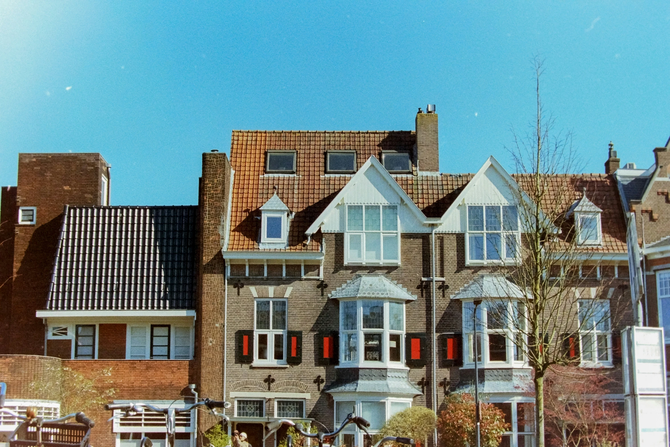 a large brown brick building with many windows