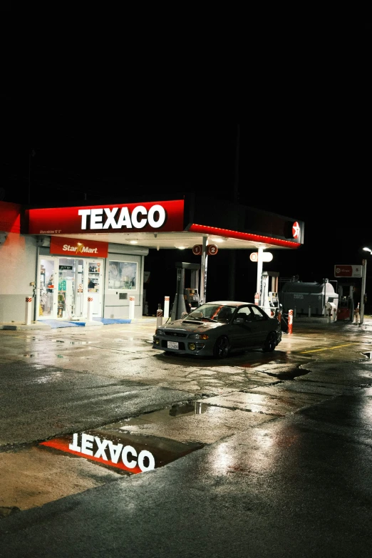 a dark picture with cars parked in front of it