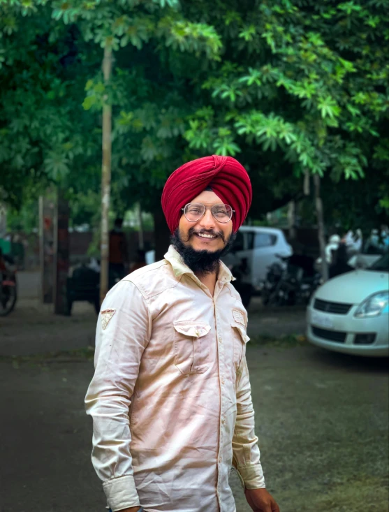 a person in a turban and some trees