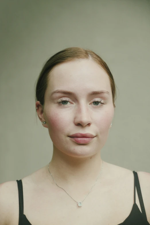 young beautiful woman with piercings on neck, posing for a portrait