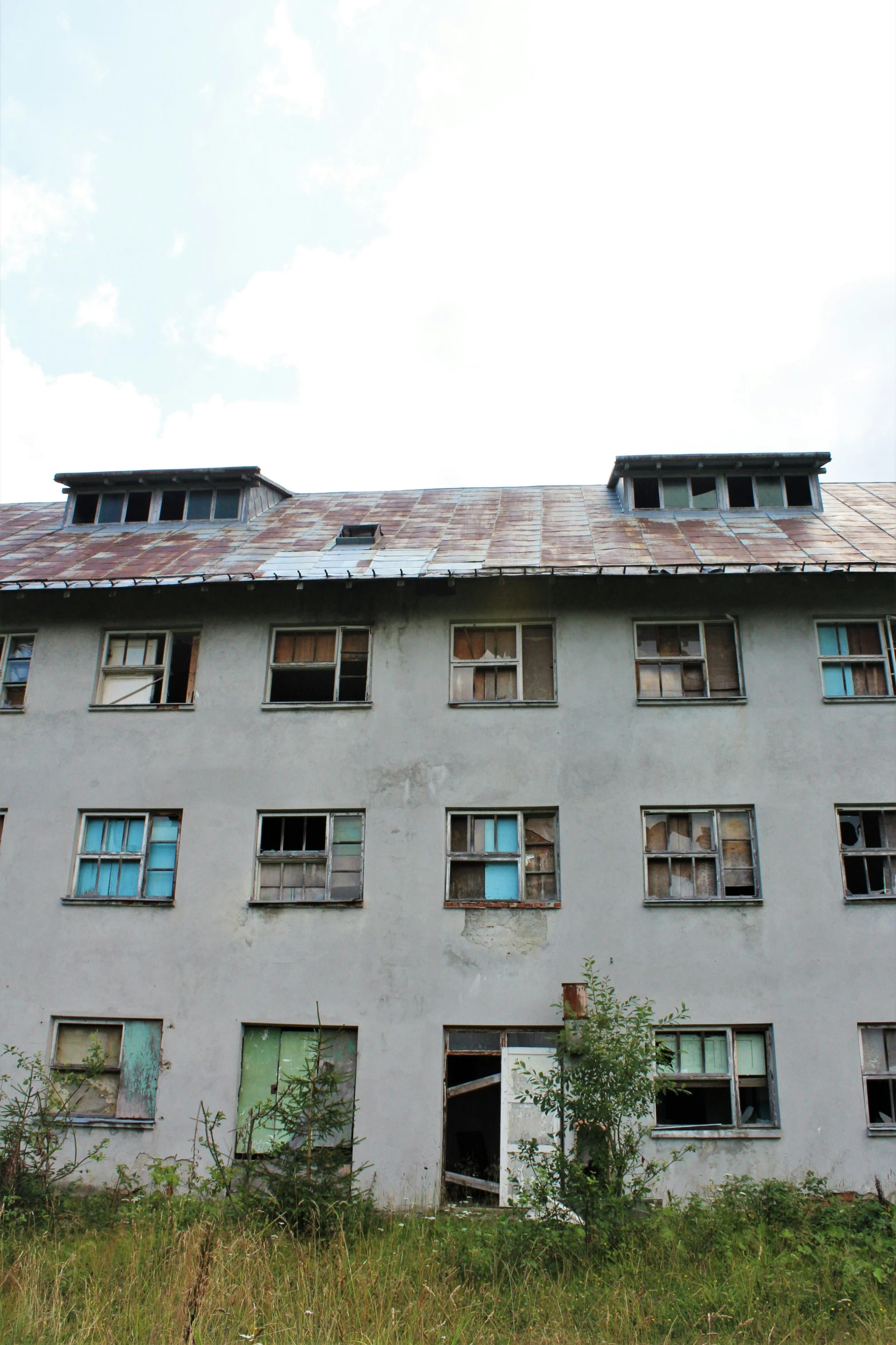 the building is grey and has lots of windows